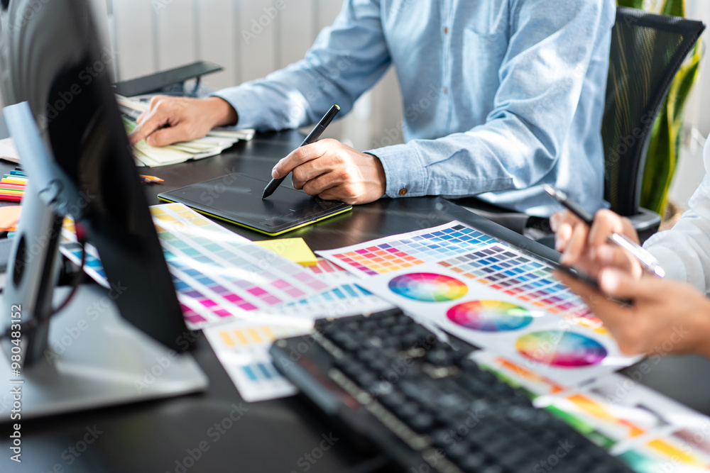 Poster two creative graphic designer team working on color selection and drawing on graphic tablet, color s