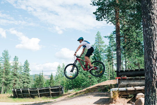 man jumping at a bike park in the mountains in Trysil