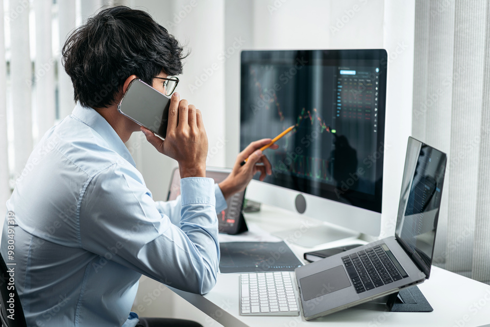 Poster businessman investor working with smartphone and computer analyzing graph stock market trading plann