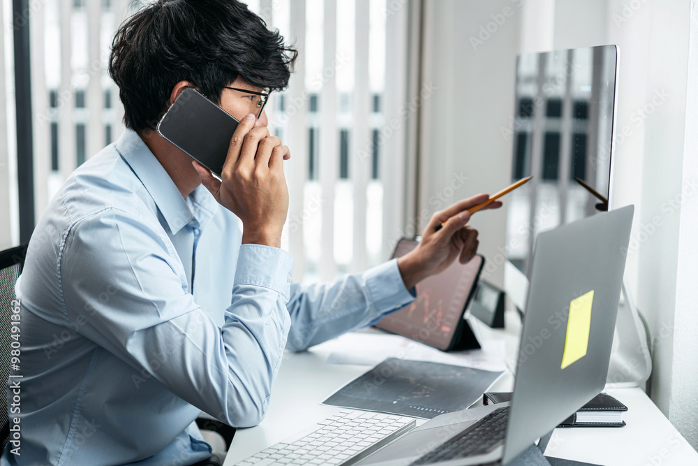 Poster businessman investor working with smartphone and computer analyzing graph stock market trading plann
