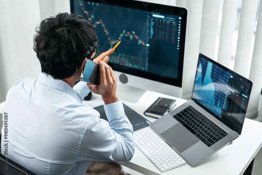 Poster businessman investor working with smartphone and computer analyzing graph stock market trading plann