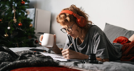 Enjoying Cozy Creative Moments Engaging in Writing and Deep Relaxation from Home Comforts