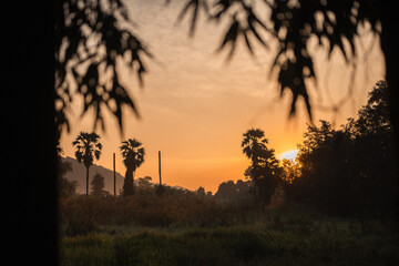 Majestic Mountain at Sunset with Sky and Cloudscape, Beautiful Landscape Captured in the Evening Light as the Sun Sets and Horizon Glows Orange, Transitioning from Dusk to Dawn with Sunlight