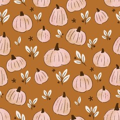 Autumn pattern with pumpkins and small flowers. Design for wrapping paper, textile and wallpaper.