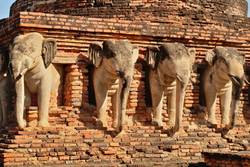 The elephant statues on the Wat Sorasak, Sarasak Pagoda, Temple at the Historical Park, the...