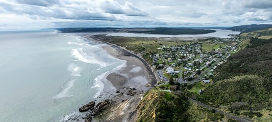 Beach, township and the river mouth of the Waikato River in Port Waikato, Waikato, New Zealand.