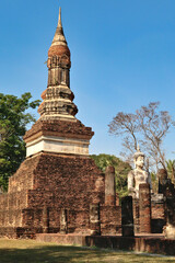 Fototapeta premium View from the side onto the Wat Tra Phang Ngoen, Wat Traphang Ngoen Temple, Historical Park, archaeological site, ancient ruins of Sukhothai, Thailand