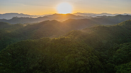 Sunrise view with mountains and forests with morning fog