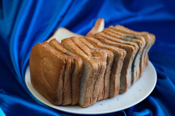 Rotten bread on the white plate