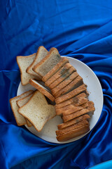 Rotten bread on the white plate