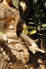 Details of a statue of a deity, guardian, phaya naga, thai dragon, mythological creature at the Wat Pha Lat Temple next to the Monks Trail up to the Doi Suthep Temple, Chiang Mai, Thailand