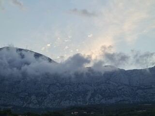 scenery of mountains in the fog. mountains in the morning. landscape with clouds.  scenic clouds over the mountains.