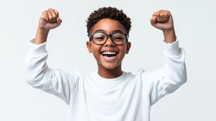 An enthusiastic Black teen making a victory gesture, embodying triumph and excitement, on a solid white background