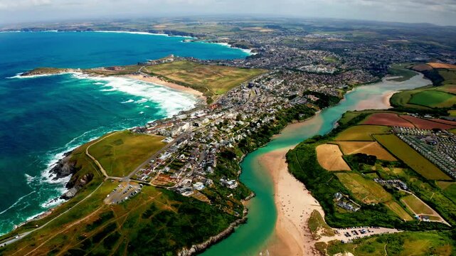 Aerial drone shot over the coastal town of Newquay in Cornwall, United Kingdom. High view of the Gannel river.