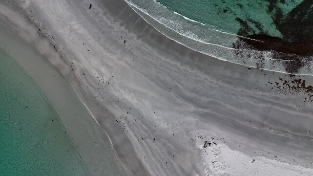 Aerial view of the white sand path that connects Bicheno Island to the beach. Tasmania, Australia.