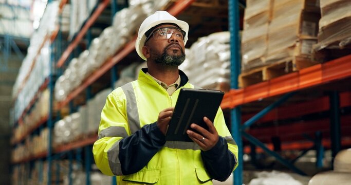 Black man, logistics and tablet at warehouse for distribution industry, stock checklist and package inventory. Worker, thinking and digital with inspection for shipping order, supply chain and safety - Powered by Adobe