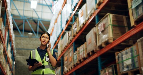 Woman, supervisor and phone call at warehouse for manufacturing, delivery and communication. Female...