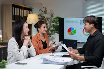 Fototapeta premium Business team giving advice Meeting and brainstorming, financial investment, real estate project, strategy, planning, calculation, pointing at graph chart on desk at office.