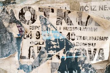 Torn and ripped street poster background, weathered paper backdrop
