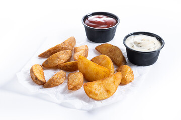 Fried potato wedges isolated on white background.