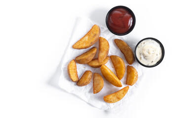 Fried potato wedges isolated on white background.