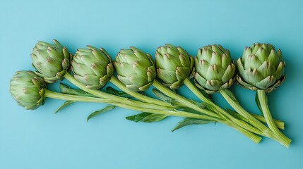 Creative Arrangement of Artichokes and Stems Forming an Upward-Pointing Arrow