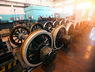 Railway maintenance workshop with locomotive and train wheels