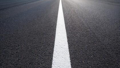 A white line on a black asphalt road.