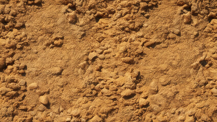 Close-up of brown sand and gravel texture with rough texture, natural pattern and grunge design.
