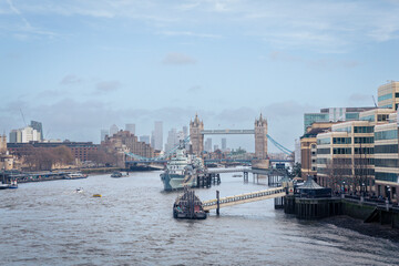 London skyline view at dusk with famous landmarks featuring the Tower Bridge, London Eye on River Thames, London, UK.