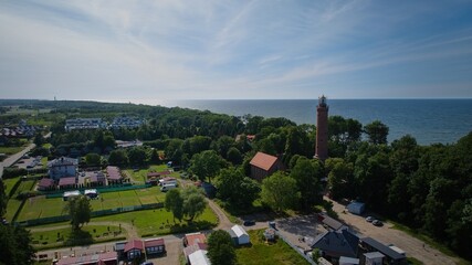 Panoramic drone shot of Gąski lighthouse, beach, and village.  © Grzegorz