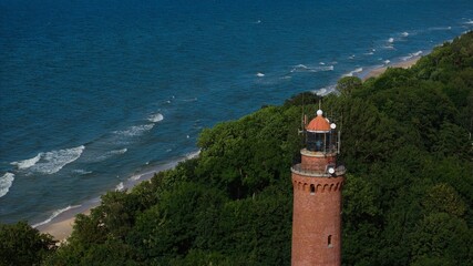 Scenic drone photo of Gąski lighthouse and Baltic shore in summer light.  © Grzegorz