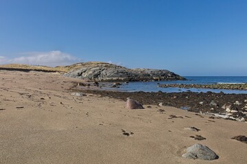Beach landscape view near Russian border on a sunny spring day, Grense Jakobselv, Norway.