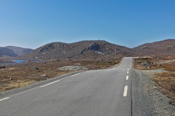 View of Grense Jakobselv road in sunny spring weather, Norway.
