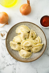 Homemade dumplings with potato and onion