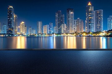 Fototapeta premium Cityscape at night with a reflection of buildings in the water.