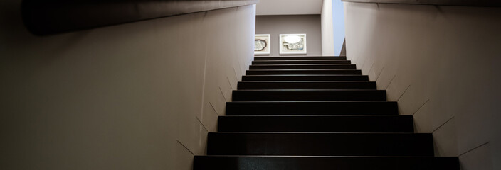 Stairs going up in a beautifully designed hotel, black stairs