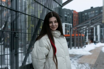 Woman Standing Next to Fence in Snow