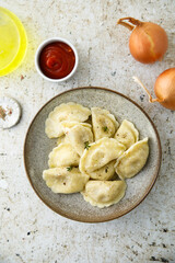 Homemade dumplings with potato and onion