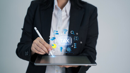 E-tax concept. Businesswomen show TAX for Individual income tax return form online for tax payment.  state taxes. Data analysis, , financial research, report.