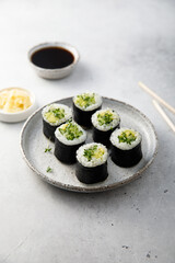 Vegan sushi rolls with avocado and cucumber