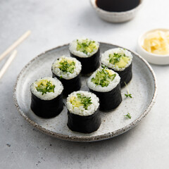 Vegan sushi rolls with avocado and cucumber