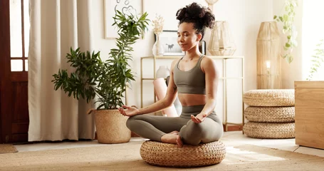 Fotobehang Lotusbloem Home, yoga and woman with meditation, lotus and peace with chakra, spiritual routine and fitness. Apartment, healthy person and girl with balance, wellness or posture with exercise and calm in lounge  © PeakPoints/peopleimages.com