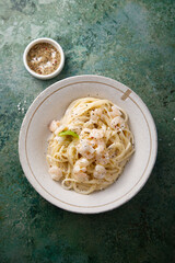 Pasta with cream sauce and shrimps