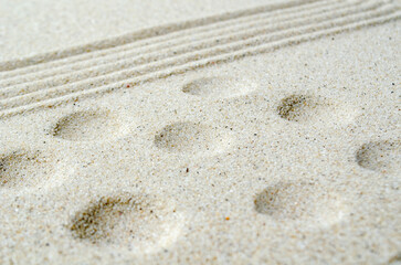 Beach sand with lines and circles. Copy space concept