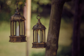 A lantern in a temple gives light. Before the arrival of electricity, there were hurricanes in every house in Bangladesh.	