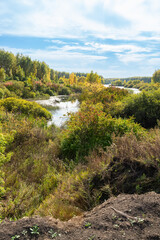 A beautiful, serene landscape with a lake and a forest.