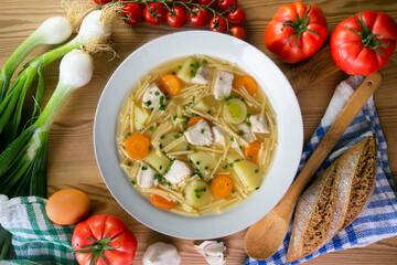 Fish, noodle and vegetable soup. Top view table with  decoration.
