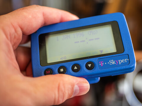 Vintage Deutsche Telekom Skyper Pager in Hand,Nostalgia of Early Mobile Communication