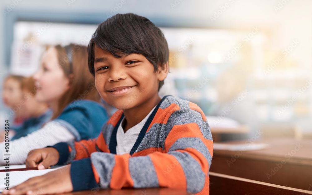 Poster Portrait, smile and boy in classroom for learning in growth, child development and notebook for education. Happy, lesson and face of student with exam notes, knowledge and study at elementary school